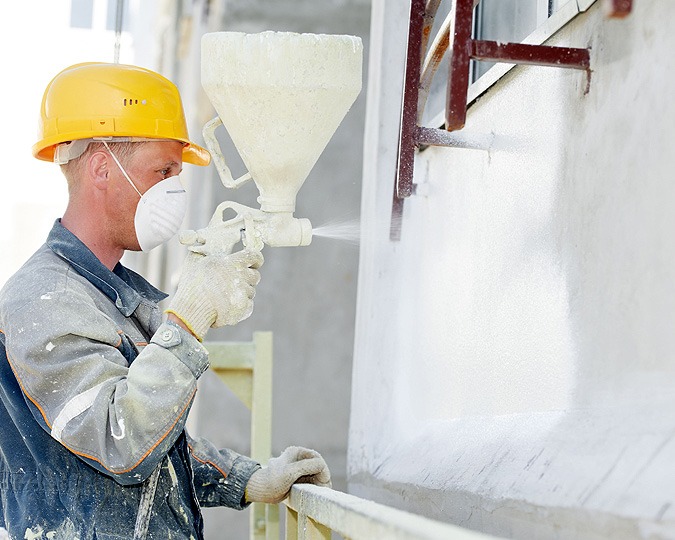 Commercial Painter using spray applicaiton